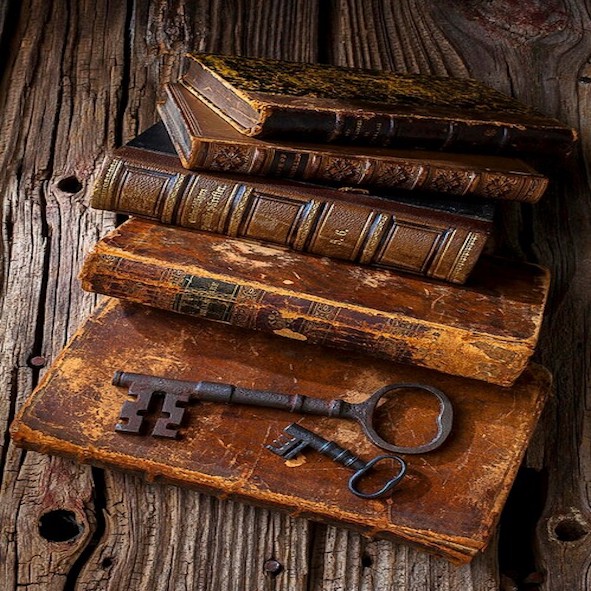 Old keys on top of stacked books